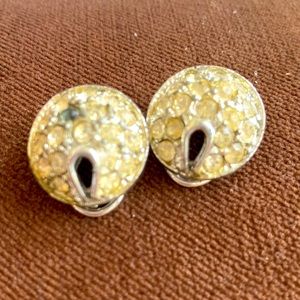 2950s rhodium and rhinestone clip earrings. No stones missing.One is “dead” gray